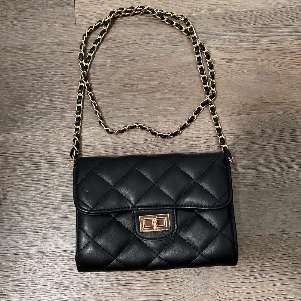 Cross body chain bag. Black and gold hardware.